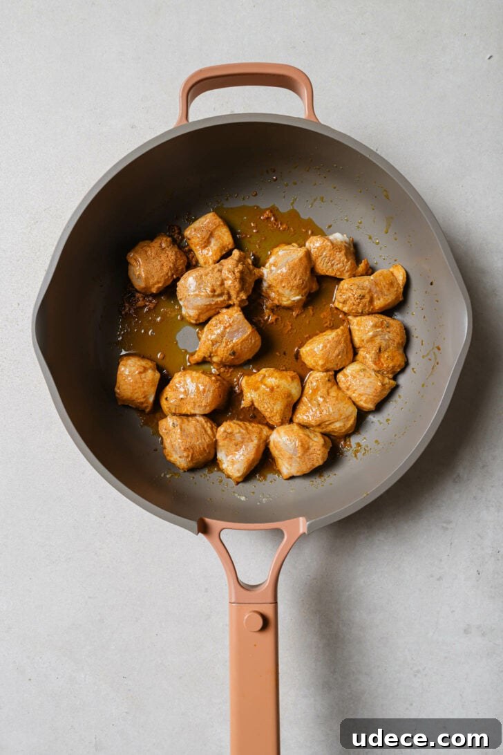 Authentic Butter Chicken Recipe: Tried and Perfected After 20 Tests 16 Marinated chicken in a skillet with butter/ghee and oil ready to be cooked