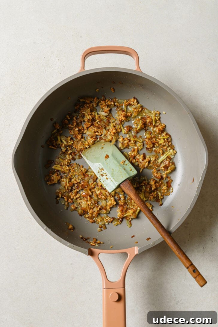Authentic Butter Chicken Recipe: Tried and Perfected After 20 Tests 19 Sautéing onions, garlic and ginger in a skillet to make sauce for Butter Chicken.