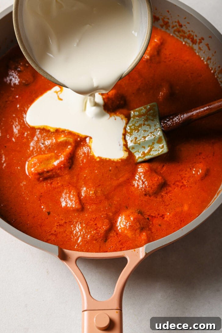 Authentic Butter Chicken Recipe: Tried and Perfected After 20 Tests 31 Pouring cream into Butter Chicken.
