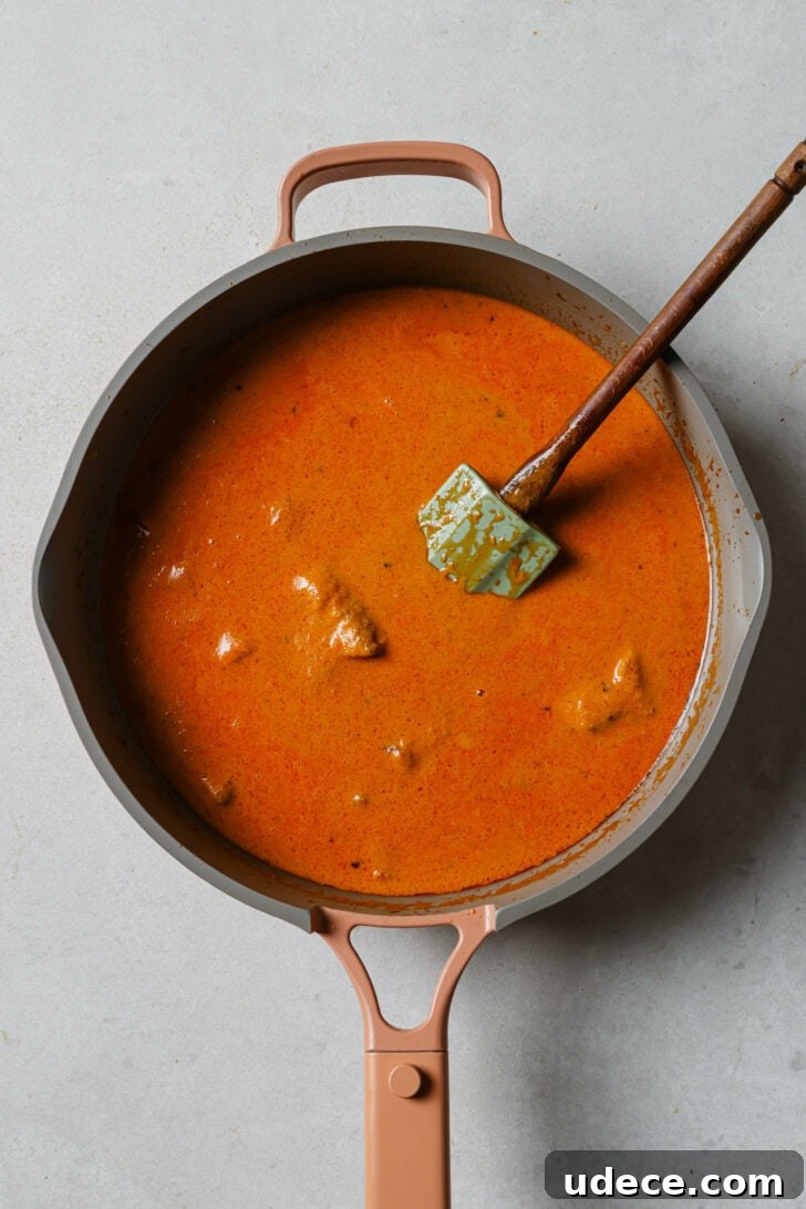 Authentic Butter Chicken Recipe: Tried and Perfected After 20 Tests 32 Cream mixed into Butter Chicken in skillet and about to be brought to a simmer.