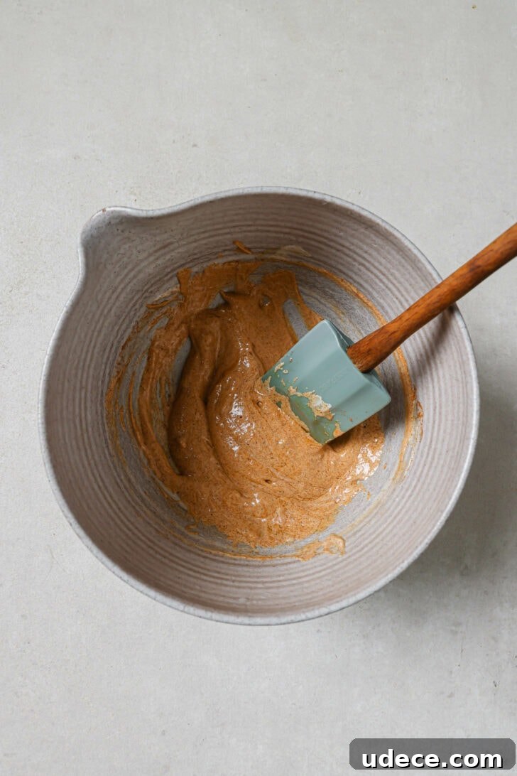 Authentic Butter Chicken Recipe: Tried and Perfected After 20 Tests 10 Mixing Butter Chicken marinade in a grey bowl.