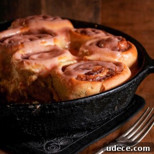 Cardamom Sweet Rolls with Blood Orange Cream Cheese Frosting 2 Sweet cardamom rolls with blood orange cream cheese frosting in a cast iron pan