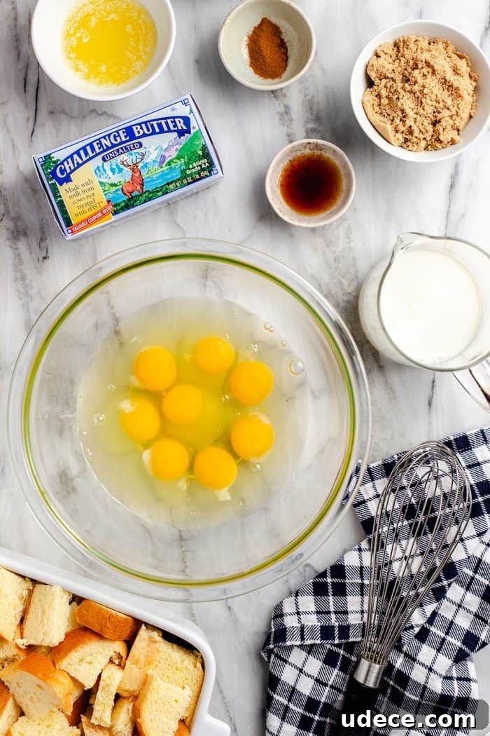 Overnight French Toast Casserole Recipe for Make-Ahead Brunch 3 Overhead view of the ingredients for overnight french toast casserole set on a marble countertop