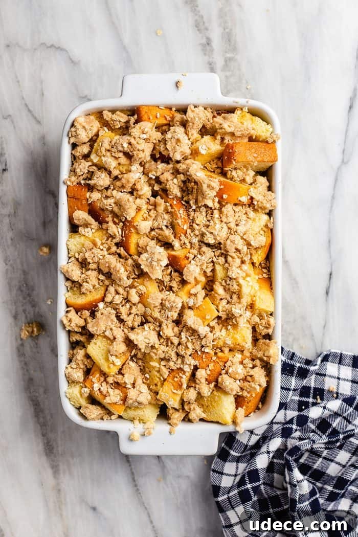 Overnight French Toast Casserole Recipe for Make-Ahead Brunch 6 Overnight french toast casserole in a white baking dish, assembled and ready to be baked