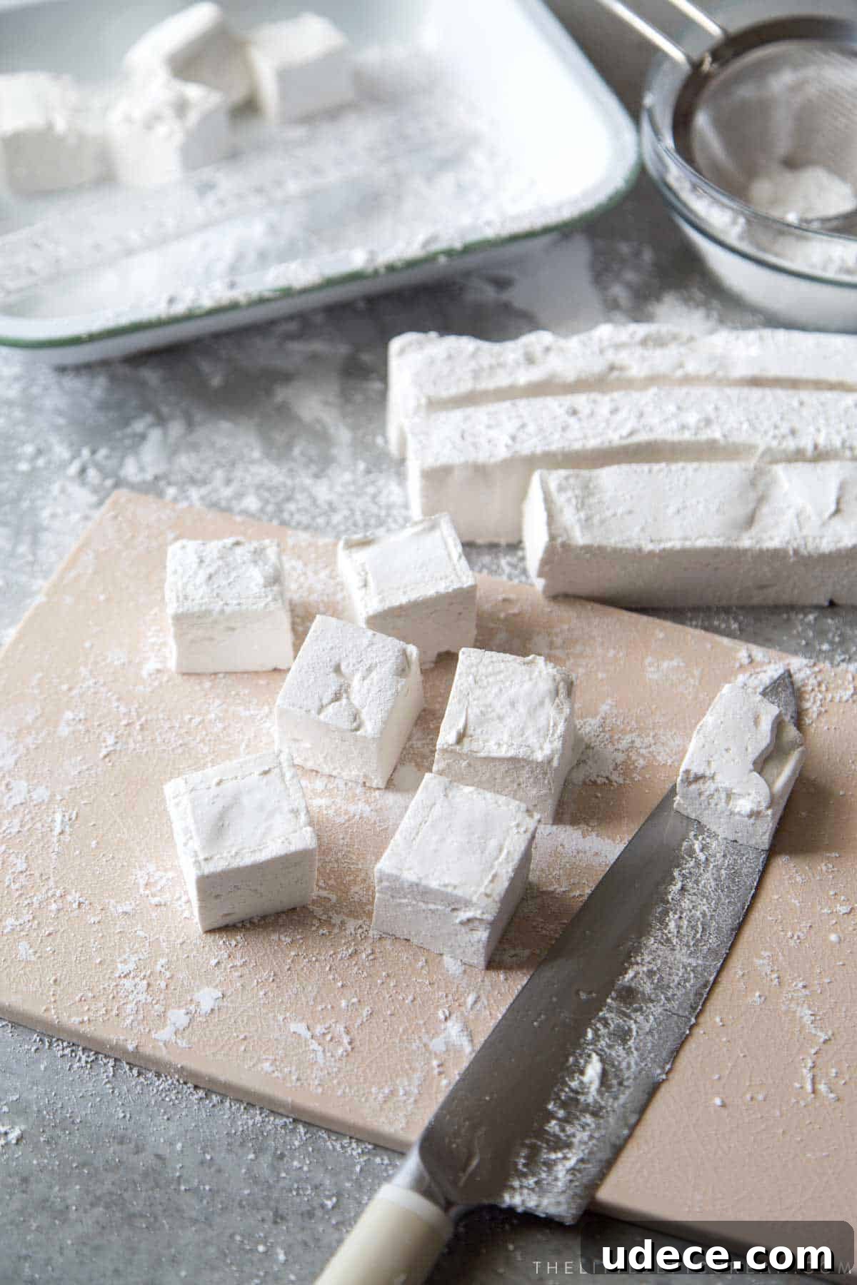 How to Make Fluffy Homemade Marshmallows at Home 14 cut marshmallows with oiled knife and toss in confectioners sugar.