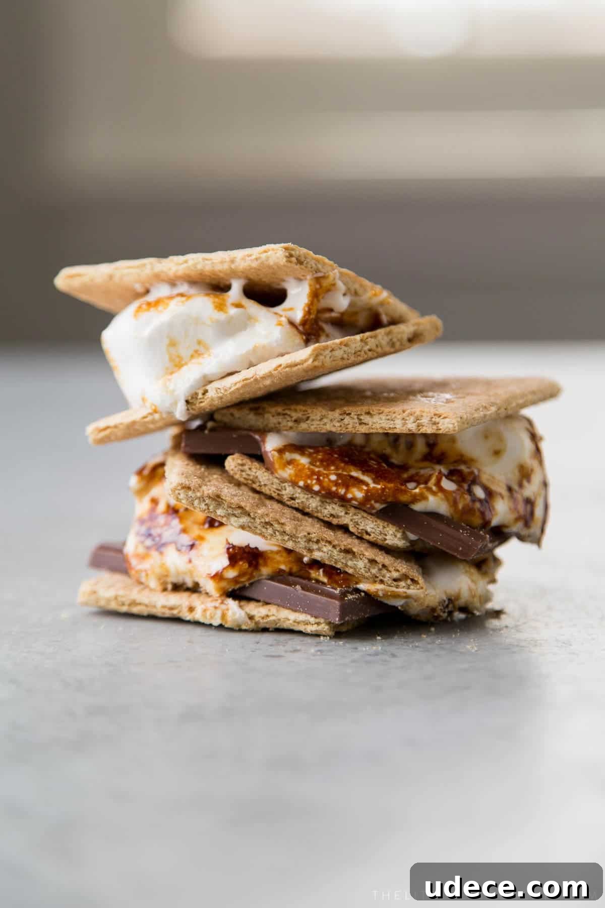 How to Make Fluffy Homemade Marshmallows at Home 3 a stack of s'mores made with homemade marshmallows.