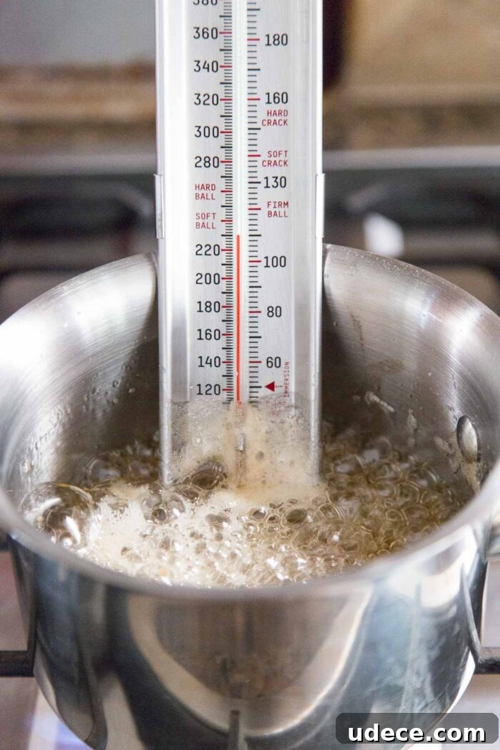 How to Make Fluffy Homemade Marshmallows at Home 9 using candy thermometer for heating sugar for marshmallows.