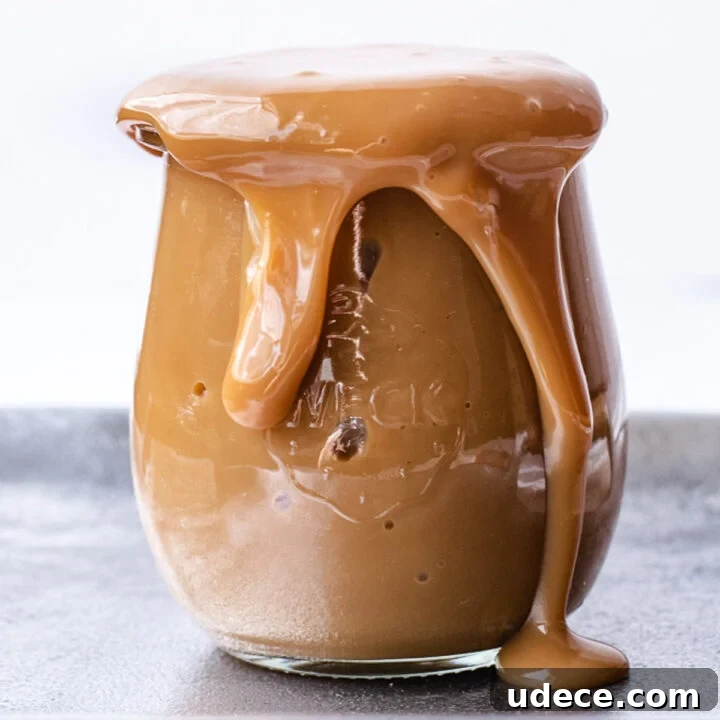 Mason jar overflowing with homemade dulce de leche.