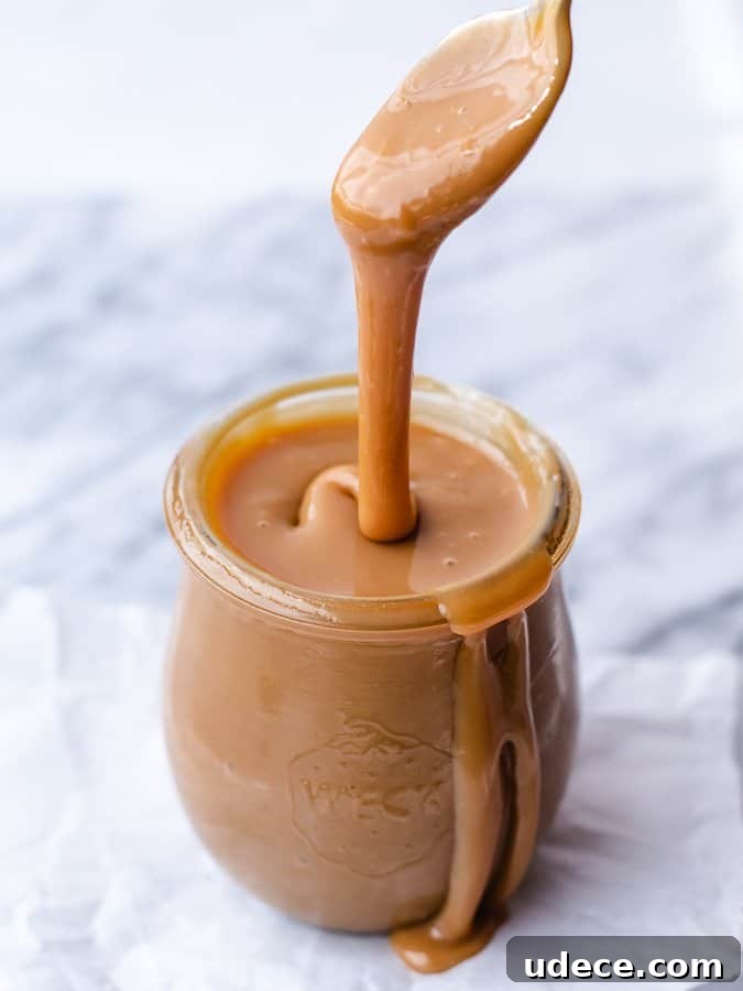 Dulce de Leche Scones Recipe — Buttery Caramel Scones Guide 7 Easy Homemade Dulce de Leche jar of caramel with spoon dripping some into the jar