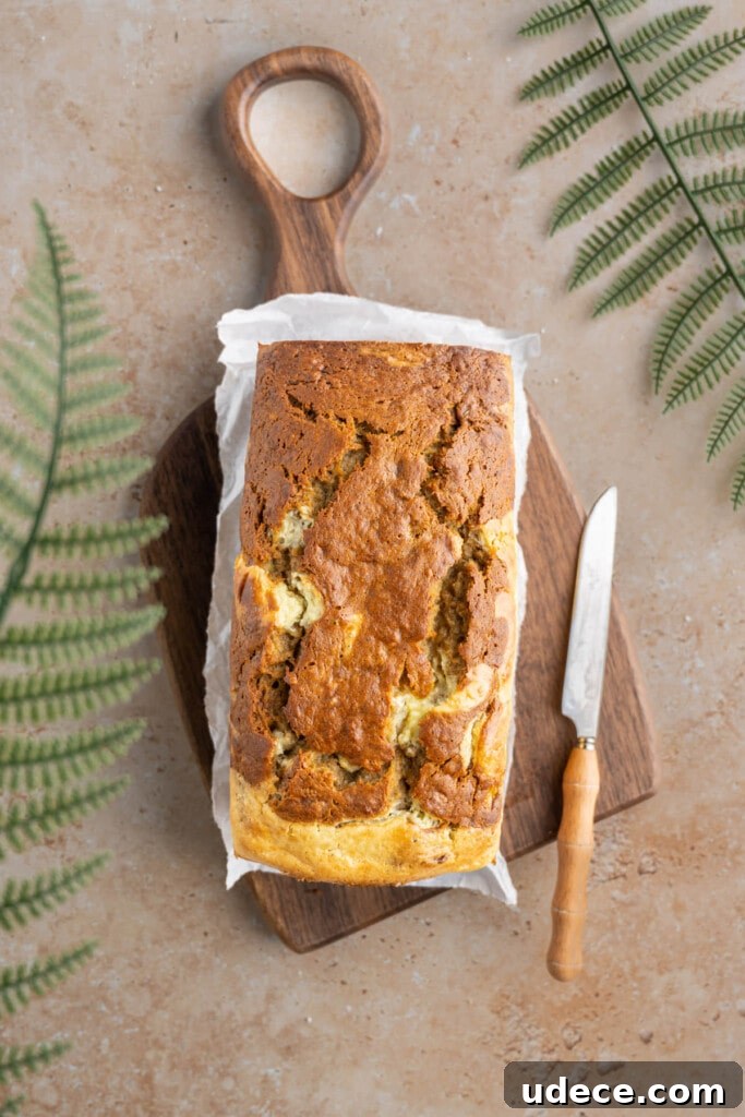 Banana bread loaf with swirled cream cheese.
