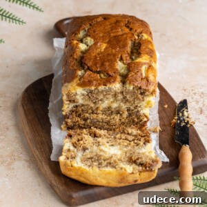 Marbled Cream Cheese Banana Bread with slice cut off to show inside texture.