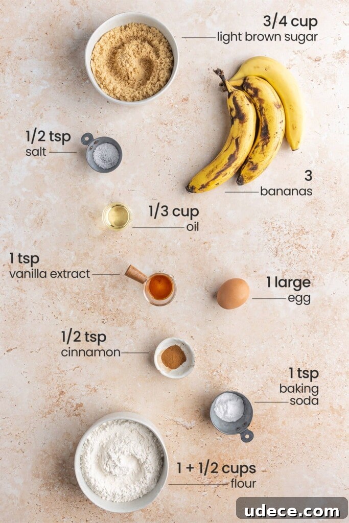 Ingredients for cream cheese banana bread - light brown sugar, salt, bananas, oil, vanilla extract, egg, cinnamon, baking soda, flour.