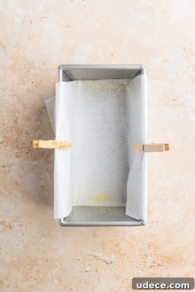 Pan half-lined with parchment paper.