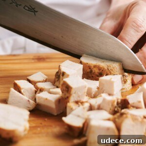 How to Cube Chicken Breast for Evenly Cut Pieces 5 Slicing chicken into cubes.