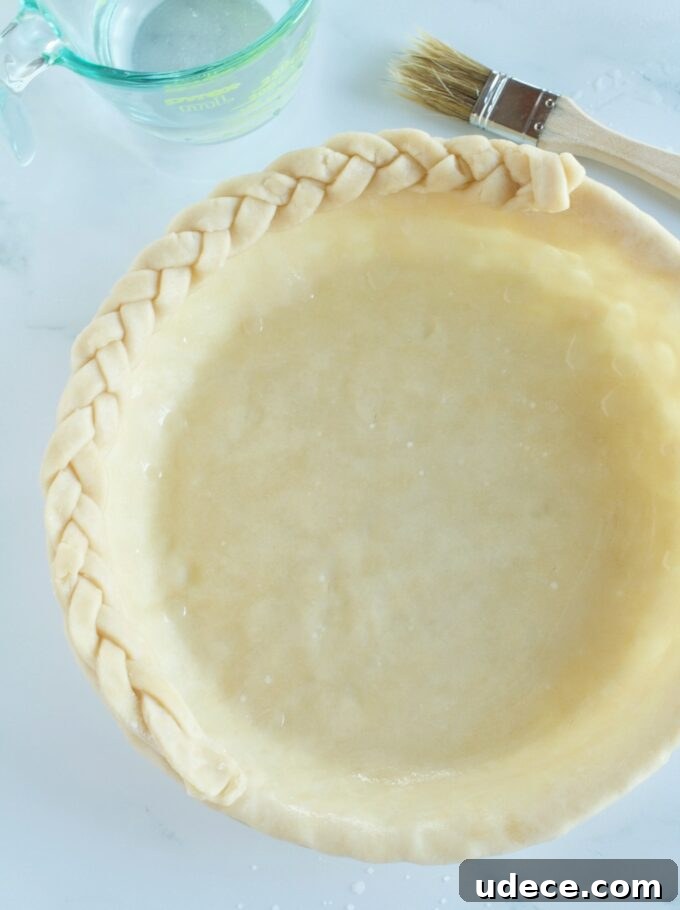 How to Braid a Pie Crust for a Beautiful Lattice Top 2 A pie shell being braided around the edges.