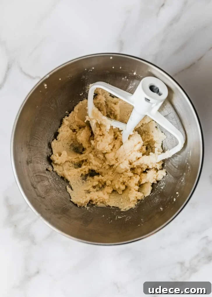 High-Altitude Yellow Cupcakes with Rich Chocolate Buttercream 4 A silver bowl of creamed butter and sugar on a marble counter.