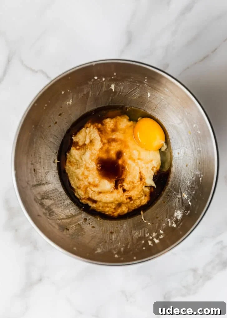 High-Altitude Yellow Cupcakes with Rich Chocolate Buttercream 5 A silver bowl of butter, sugar, eggs, and vanilla.