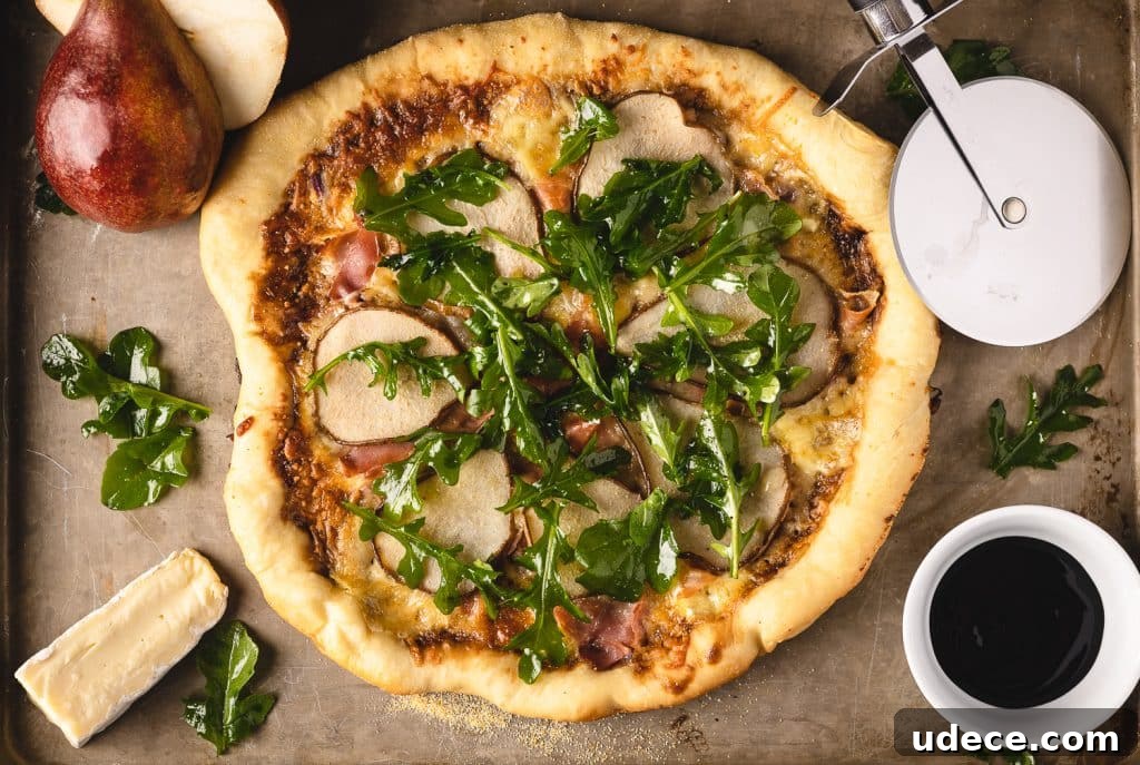 Dutch Oven Pizza with Pear, Brie & Prosciutto Recipe 5 Dutch oven deep dish pizza on a cutting board.