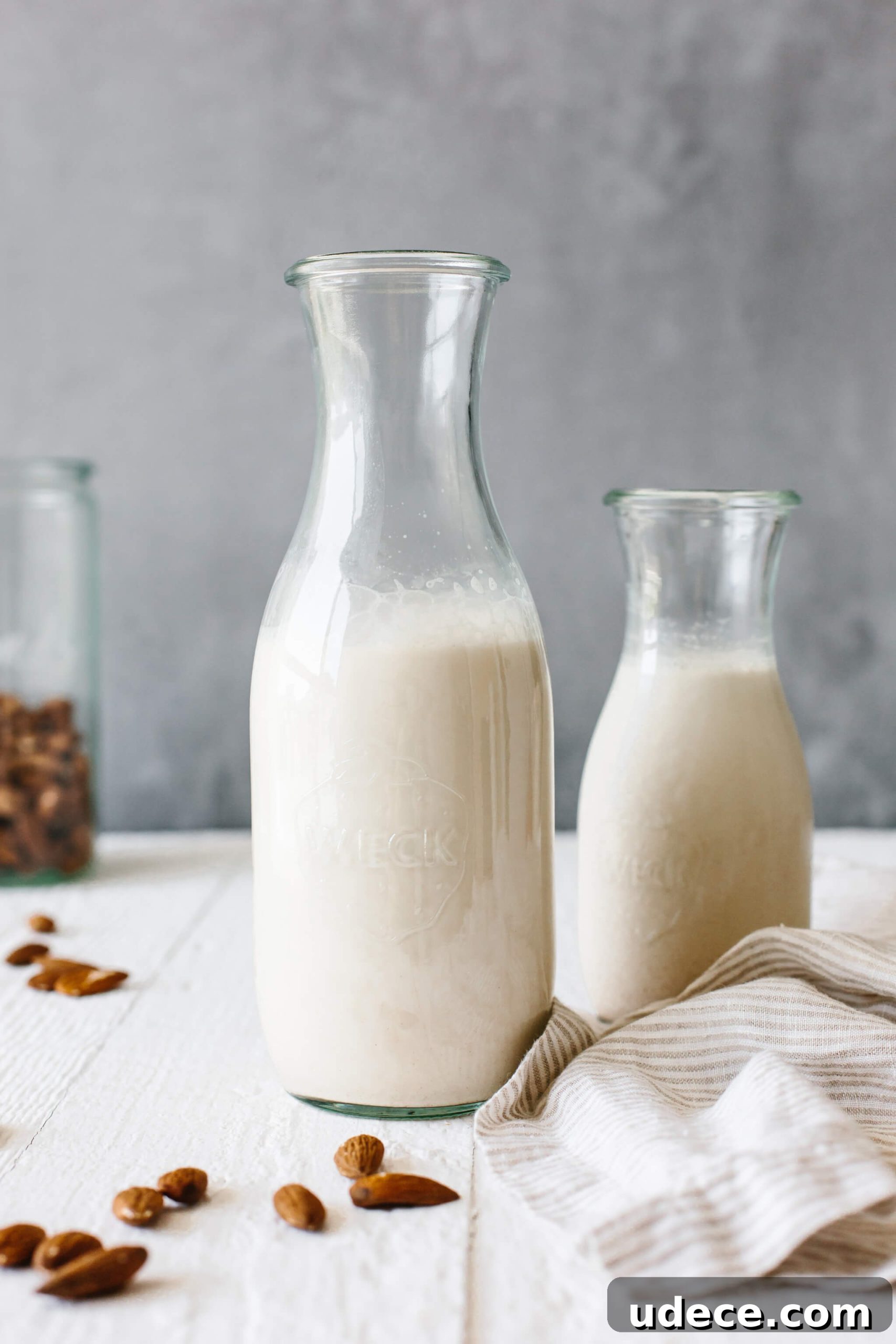 Homemade almond milk in a glass container.