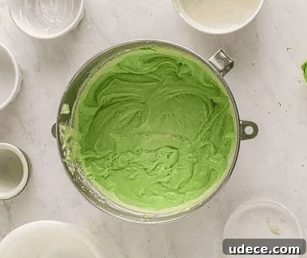 Festive Cinco de Mayo Cupcake Recipes and Decorating Ideas 7 green cupcake batter in a stainless steel mixing bowl.