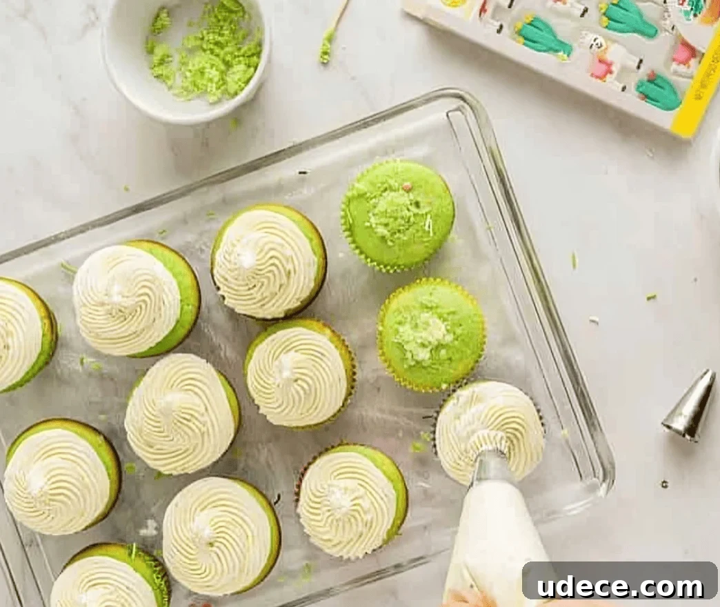 Festive Cinco de Mayo Cupcake Recipes and Decorating Ideas 10 frosting green cupcakes on a wire rack.