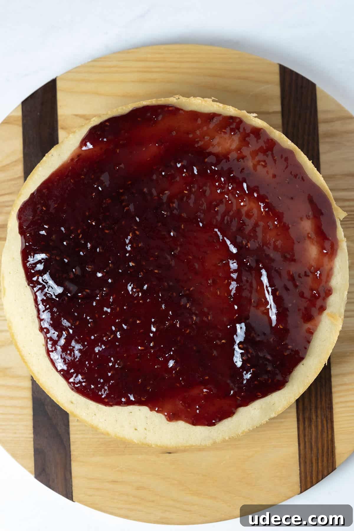 raspberry jam spread on second layer
