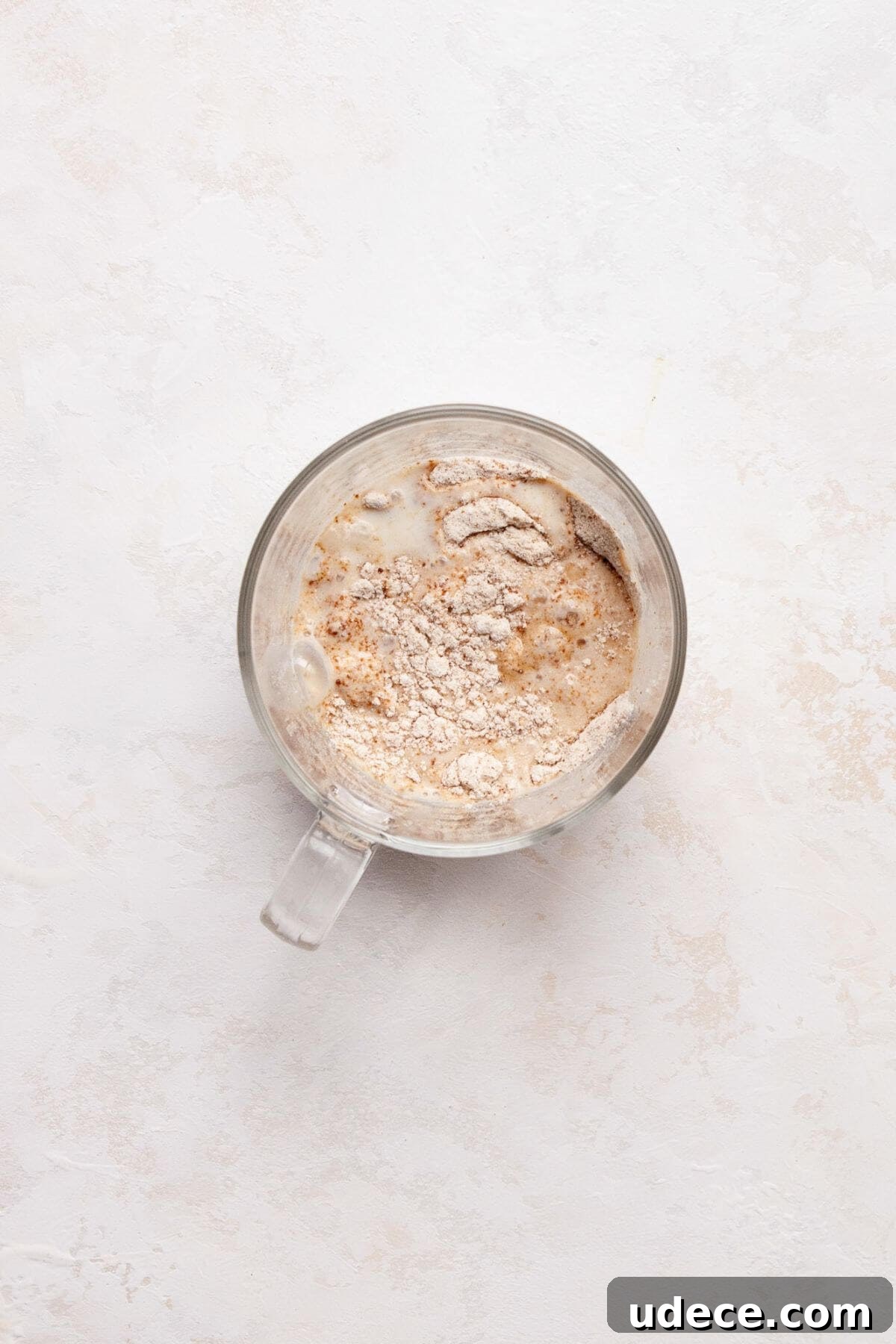 Protein Powder Mug Cake Recipe — Quick Single-Serve Dessert 4 Mixing the dry ingredients with the wet ingredients in a mug.