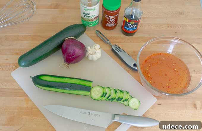 Tangy Pickled Cucumber & Red Onion Salad Recipe 4 Pickled Cucumber and Red Onion Salad ingrediants being prepped on white cutting board