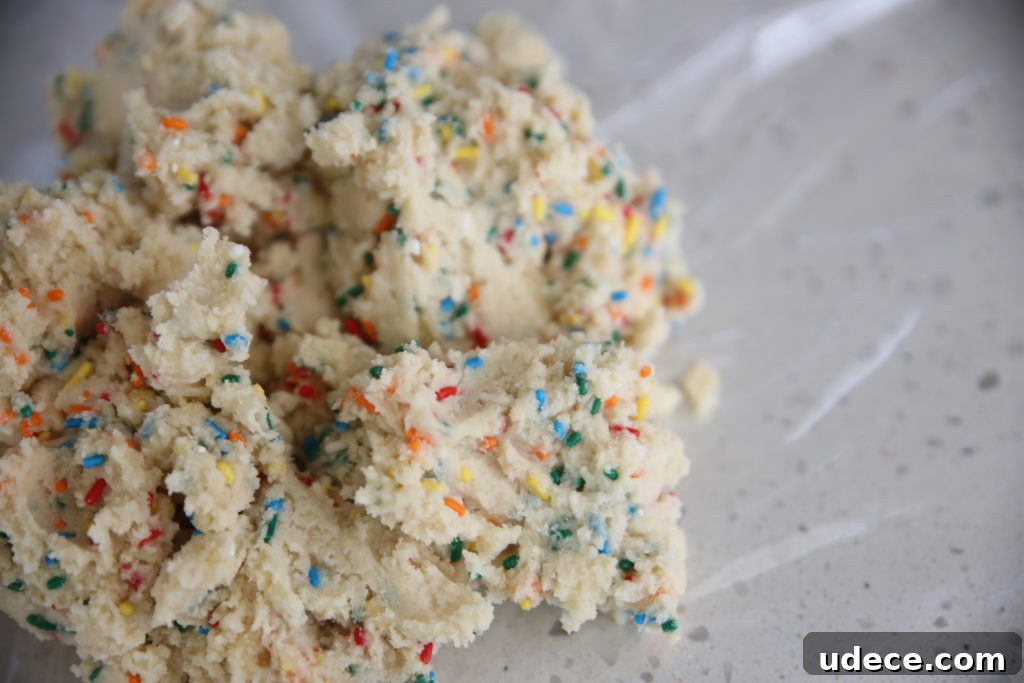 Homemade Funfetti Sugar Cookies: From Scratch Recipe 4 Mixing sprinkles into dough