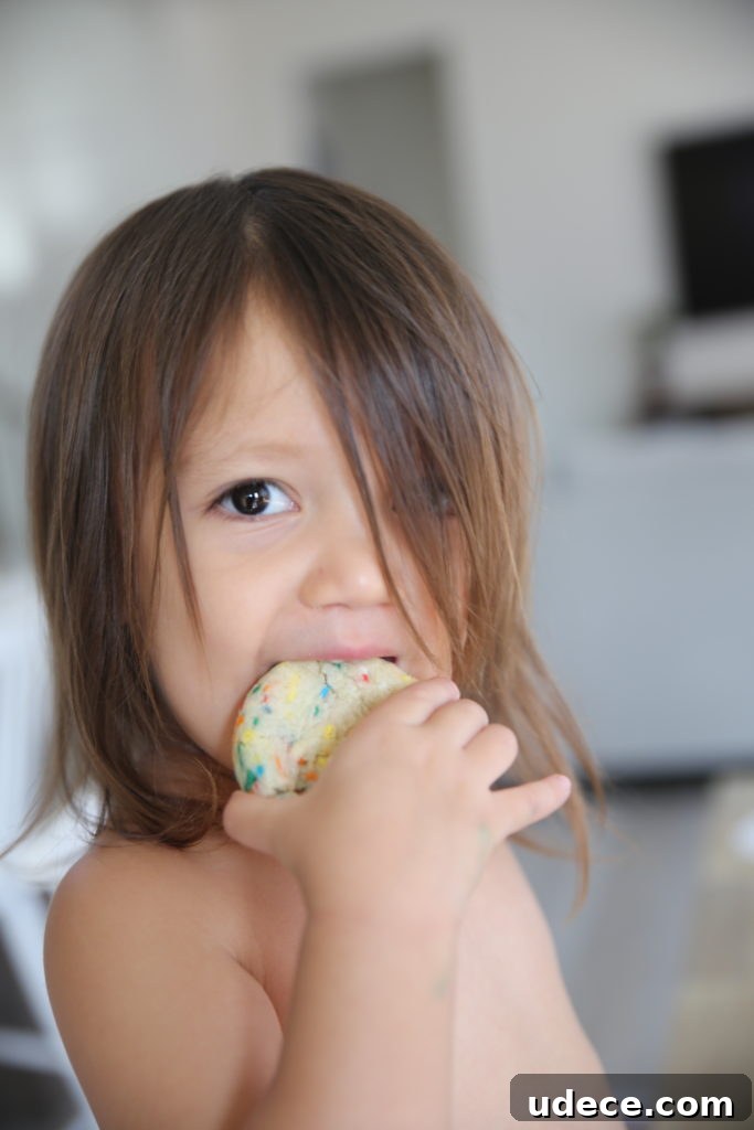 Homemade Funfetti Sugar Cookies: From Scratch Recipe 6 Child reaching for a cookie
