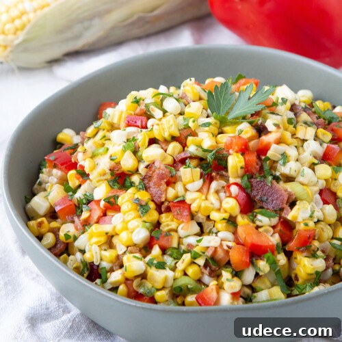 grilled corn salad in a green bowl