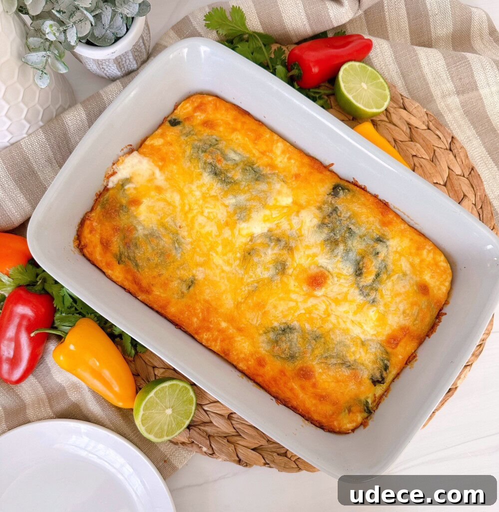 Chili Relleno Casserole Recipe: Cheesy Roasted Poblanos Bake 2 Chili Relleno Casserole in a grey casserole dish surround by peppers and limes.
