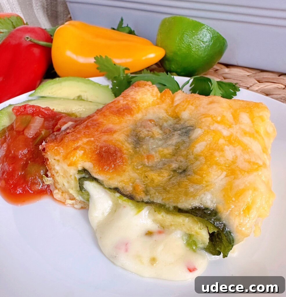 Chili Relleno Casserole Recipe: Cheesy Roasted Poblanos Bake 15 Chili Relleno Casserole serving on a dinner plate with sides.