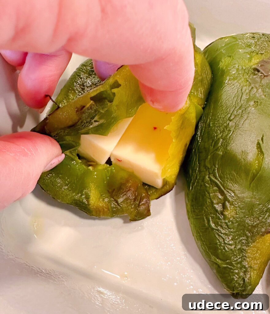 Chili Relleno Casserole Recipe: Cheesy Roasted Poblanos Bake 8 Peppers stuffed with sliced cheese.