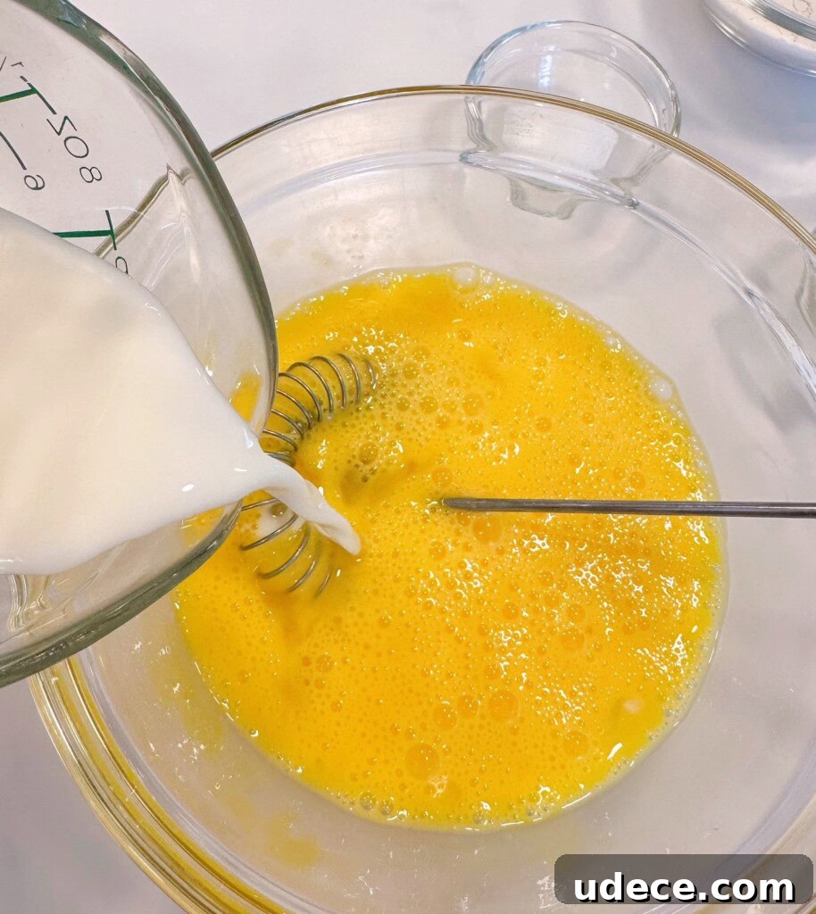Chili Relleno Casserole Recipe: Cheesy Roasted Poblanos Bake 9 Adding milk to beaten eggs.
