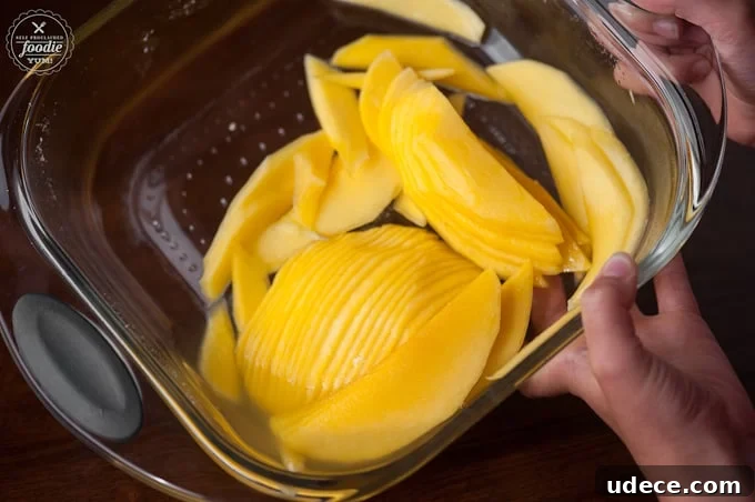 Mango Coconut Daiquiri Recipe: Tropical Cocktail Guide 3 thinly sliced mango in glass pan