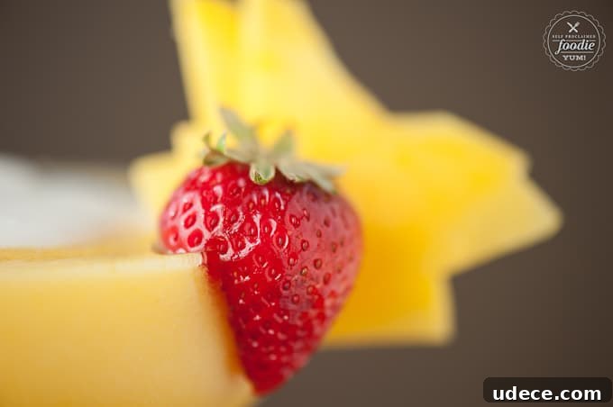 Mango Coconut Daiquiri Recipe: Tropical Cocktail Guide 6 A close up of a strawberry and mango garnish