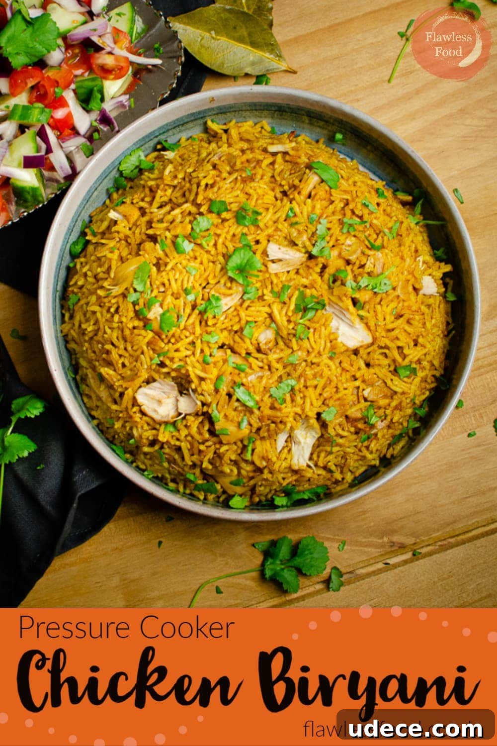 Authentic Pressure Cooker Chicken Biryani Recipe – Ready Fast 14 Pressure cooker Chicken Biryani served in a green bowl with salad on the side on a wooden table for a Pinterest image