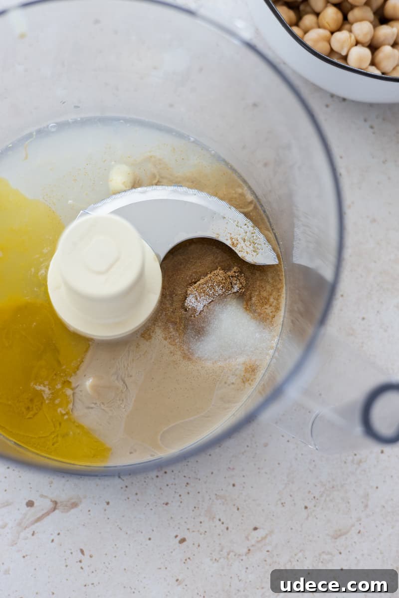 Ingredients in a food processor for mixing.
