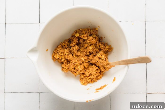 Homemade Butterfinger Candy Recipe Without Candy Corn 5 The doughy filling made from peanut butter and corn flakes for making homemade butterfingers in a bowl.