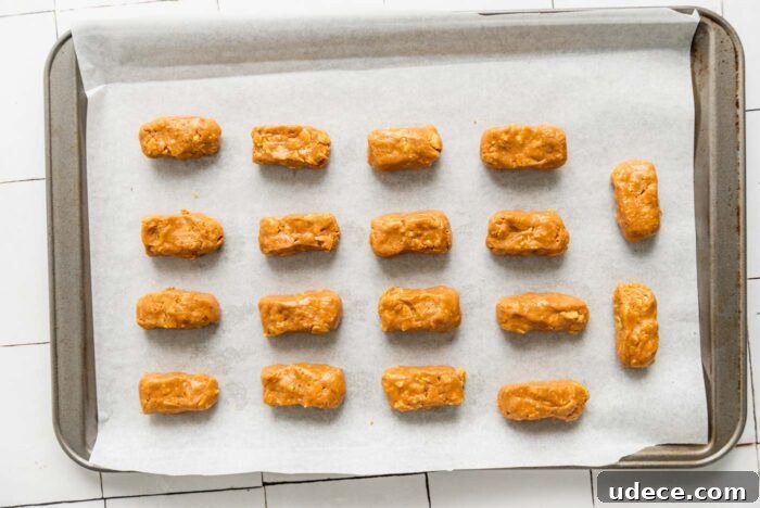 Homemade Butterfinger Candy Recipe Without Candy Corn 6 18 small butterfinger candy bars on a baking sheet before they've been coated in melted chocolate.