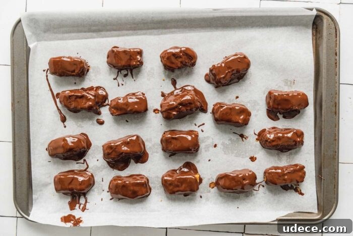 Homemade Butterfinger Candy Recipe Without Candy Corn 7 18 small homemade chocolate coated candy bars on a baking sheet lined with parchment paper.