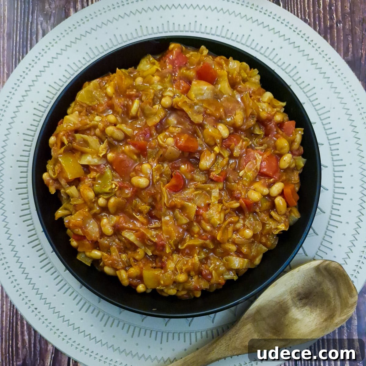 Chakalaka Recipe: Authentic South African Spicy Vegetable Relish 2 A black serving dish filled with spicy chakalaka.