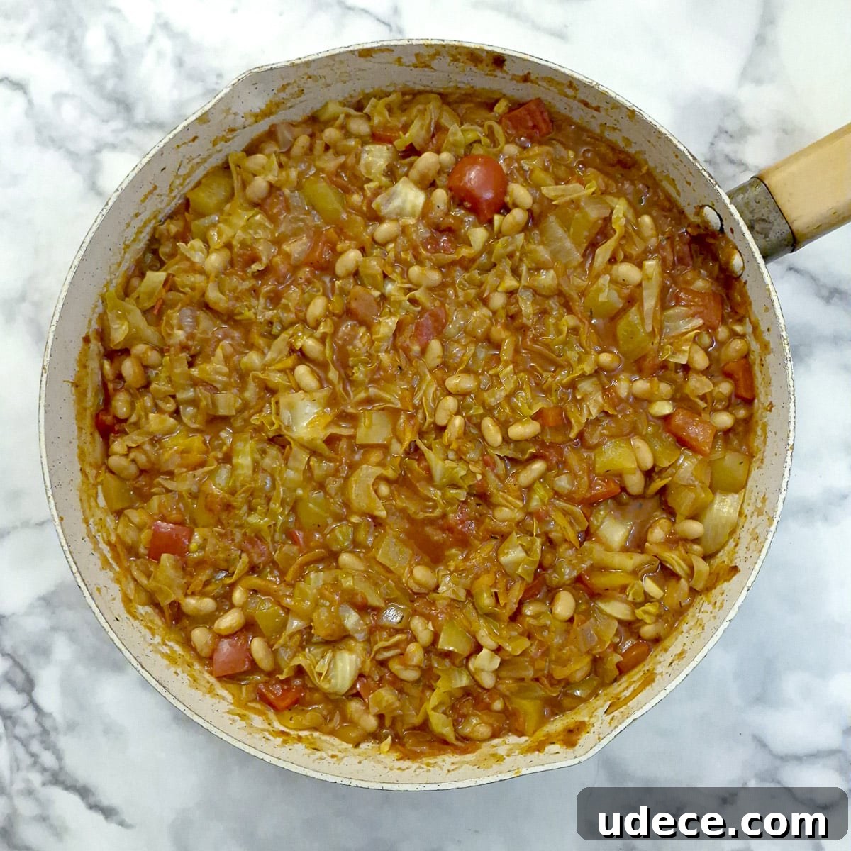 Chakalaka Recipe: Authentic South African Spicy Vegetable Relish 11 Step 7, baked beans stirred into chakalaka to complete the dish.