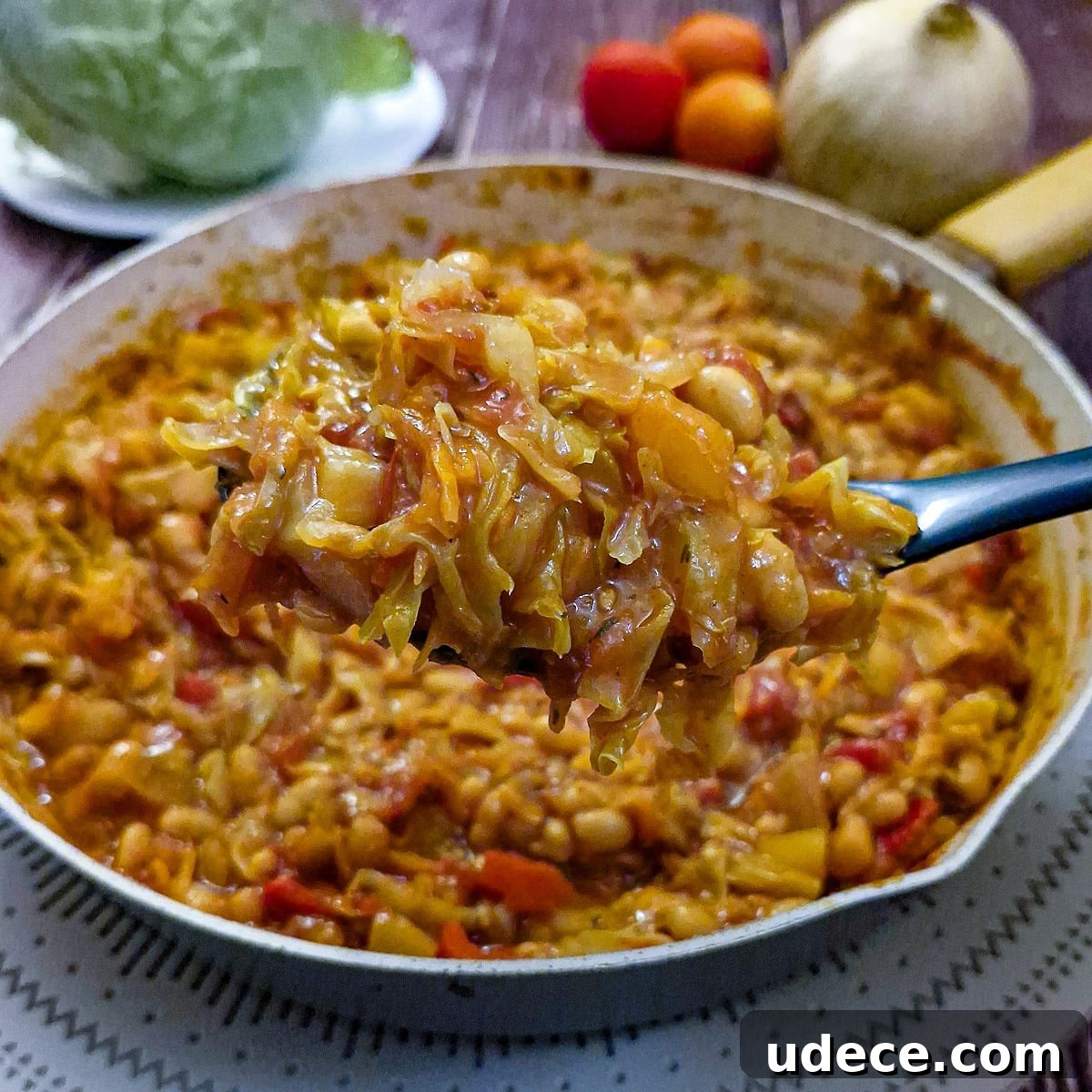 Chakalaka Recipe: Authentic South African Spicy Vegetable Relish 12 A spoonful of chakalaka held over the pan, showing the texture.