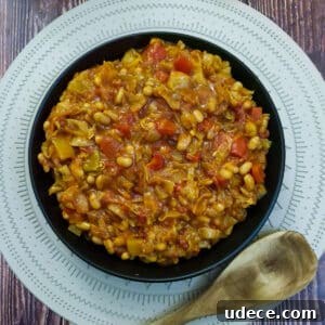 Chakalaka Recipe: Authentic South African Spicy Vegetable Relish 13 A black serving dish filled with spicy chakalaka.