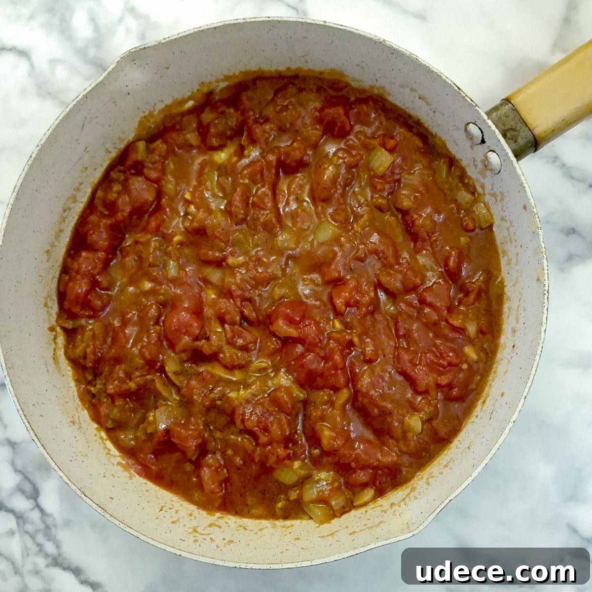 Chakalaka Recipe: Authentic South African Spicy Vegetable Relish 7 Step3, a can of tomatoes added to the pan.