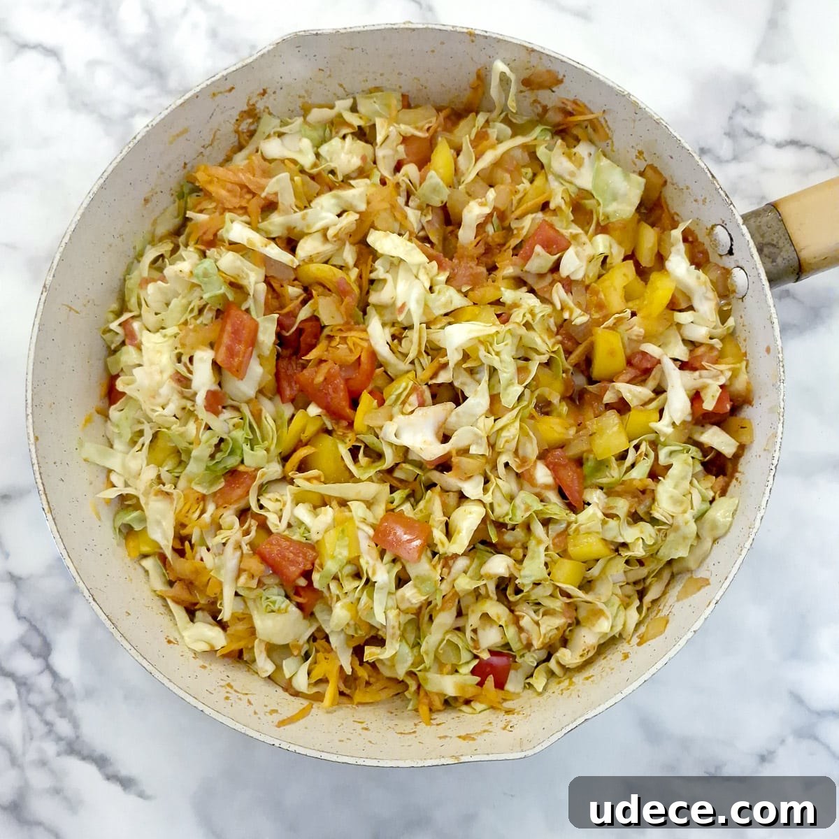 Chakalaka Recipe: Authentic South African Spicy Vegetable Relish 9 Step 5, the vegetables combined with the tomato mixture in a pan.