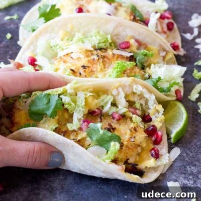 Crazy for tacos? Add these Crispy Fish Tacos to your menu! Crispy baked cod topped with pomegranates, shredded pear, and Honey Lime Crema. Simple to make at home!