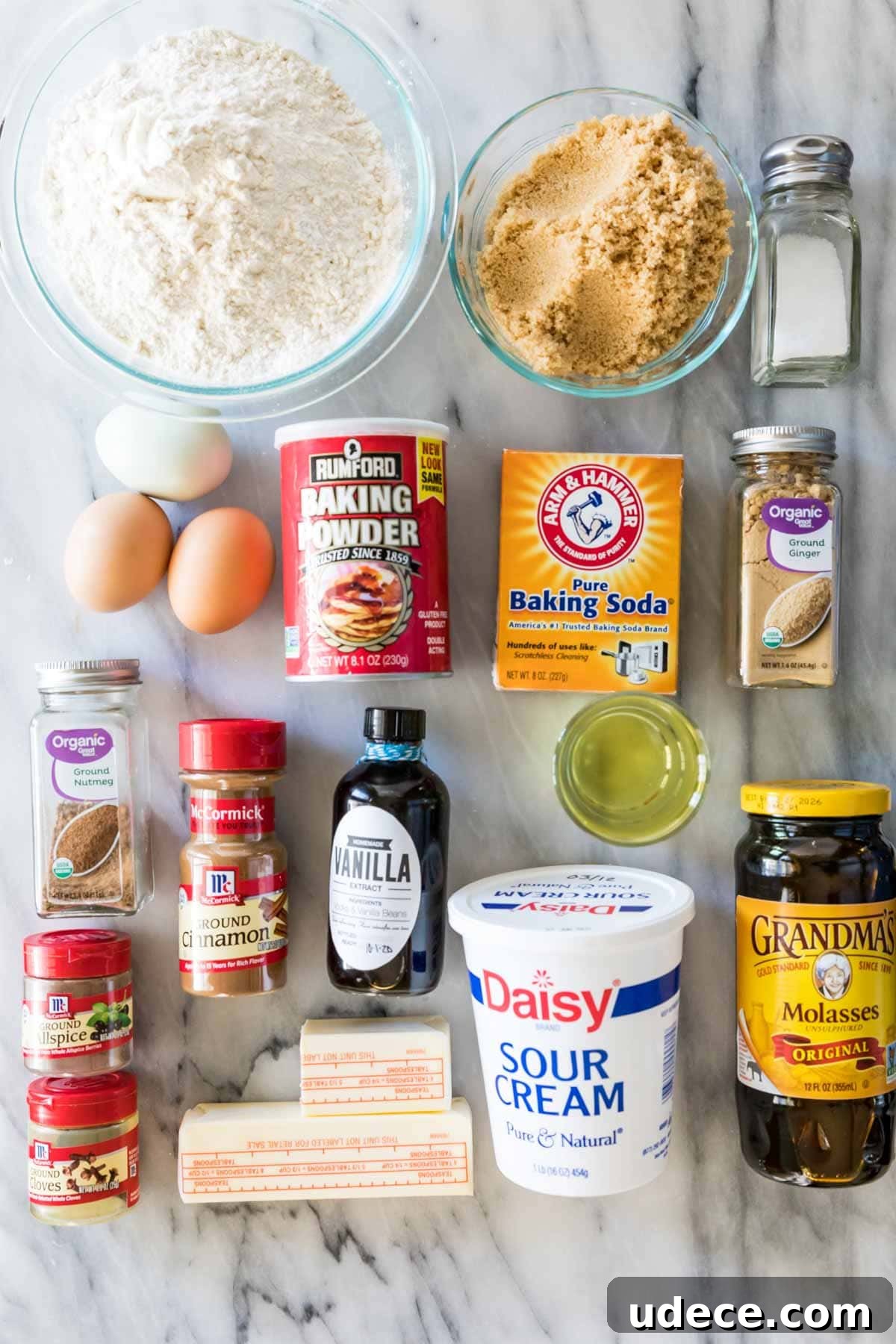 Gingerbread Layer Cake Recipe with Spiced Cream Cheese Frosting 3 Overhead view of ingredients including brown sugar, molasses, ginger, and more.